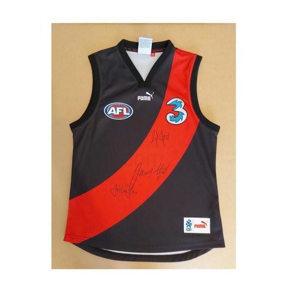 ESSENDON JUMPER SIGNED BY BROWNLOW HIRD GRAHAM MOSS & GAVIN WANGANEEN