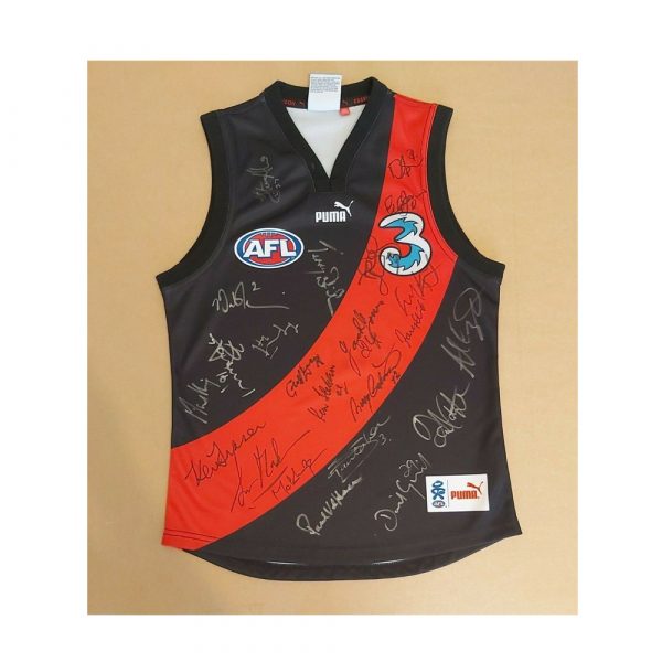 ESSENDON JUMPER SIGNED BY 23 LEGENDS HIRD MADDEN FLETCHER JONES DANIHER HARVEY